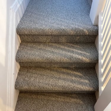 Gladiator berber carpet installed on stairs and landing – durable wall-to-wall finish in residential space