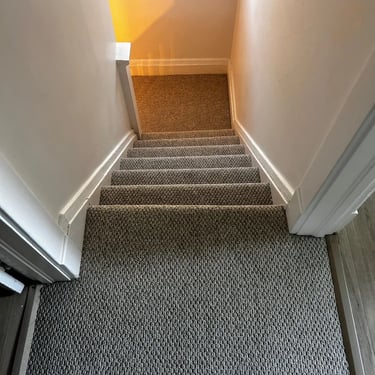 Gladiator berber carpet installed on stairs and hallway – durable textured finish in residential home