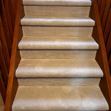 Beige low pile plush carpet installed on basement stairs in London Ontario residential home, affordable and soft