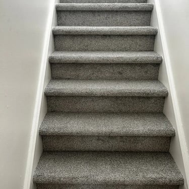 Grey plush carpet installed wall to wall on staircase in Southcrest London Ontario