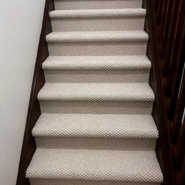 White berber carpet installed wall-to-wall on residential staircase in London Ontario, durable and textured flooring