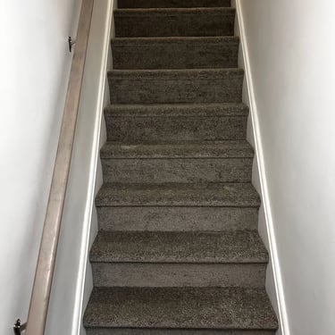 Dark brown carpet installed wall-to-wall on residential staircase in Oakridge London Ontario