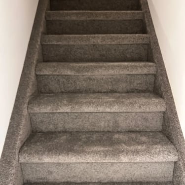 Dark grey plush carpet wall-to-wall installation on residential staircase in St. Thomas Ontario