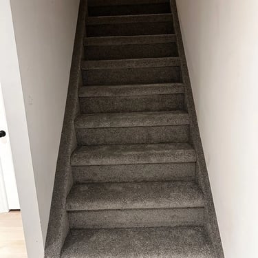 Dark grey plush carpet wall-to-wall installation on residential staircase in White Oaks London