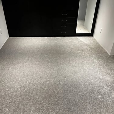 Grey carpet installed wall-to-wall in warm and soft basement space in Tillsonburg Ontario residential home