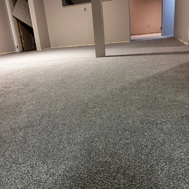 Basement with grey low pile plush carpet installed wall-to-wall in Oakridge London Ontario residential home