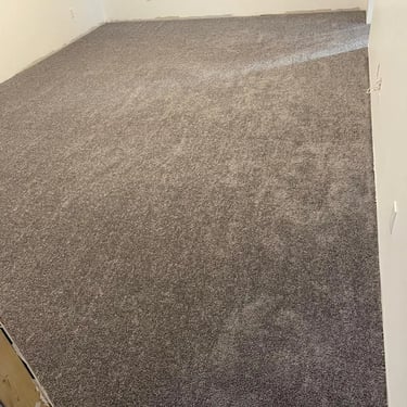 Dark grey plush carpet installed wall-to-wall in basement of Masonville London residential home