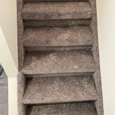 Dark grey plush carpet installed on residential staircase, wall-to-wall in Masonville London home