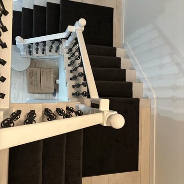 Black runner carpet on staircase – top view of modern stair runner installation in London Ontario