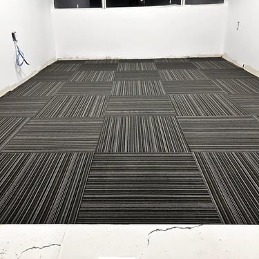 Office space with black commercial carpet tile, line pattern, quarter-turn layout – Downtown London ON