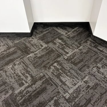 Dark grey office carpet tile with pattern, angled view of commercial flooring in Masonville, London