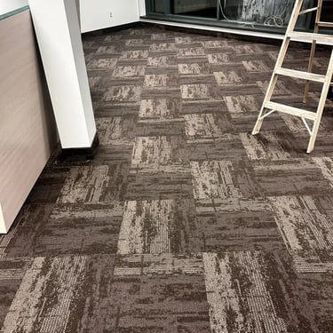 Dark grey commercial carpet tile with geometric design installed in office space in Masonville London