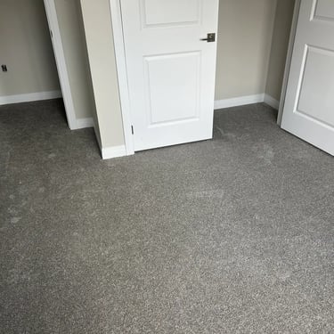 Bedroom with grey plush carpet and carpeted closet side, wall-to-wall installation in Alymer Ontario home