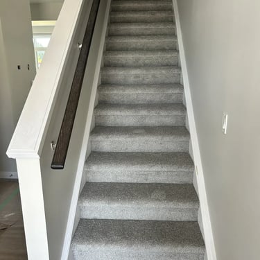 Grey plush carpet stairs with wall-to-wall installation and soft texture in Fanshawe London residential home
