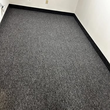 Charcoal commercial carpet installed wall-to-wall in office room in London Ontario, durable and modern flooring