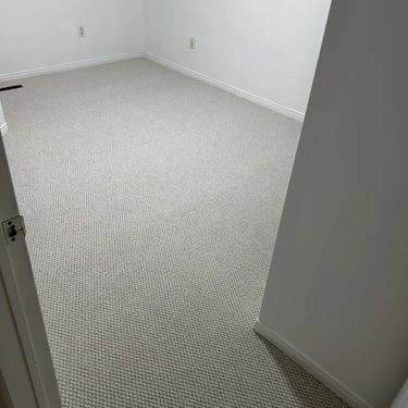 Second bedroom with thick white berber carpet installed wall-to-wall in London Ontario residential home