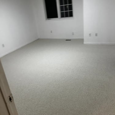 Bedroom with thick white berber carpet installed wall-to-wall in London Ontario residential home