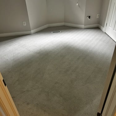 Bedroom with light grey arrow pattern carpet, wall-to-wall installation in Byron London home