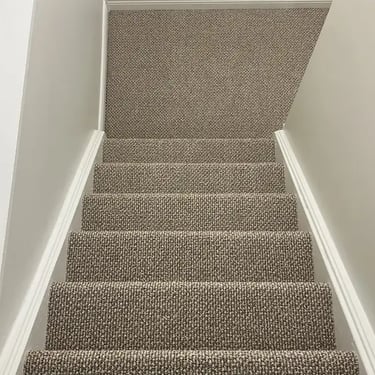 Interstellar Berber carpet professionally installed on a residential staircase in London, Ontario by Master Carpet