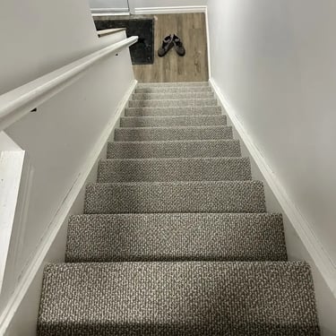 Interstellar Berber carpet professionally installed on stair treads in a London Ontario home by Master Carpet
