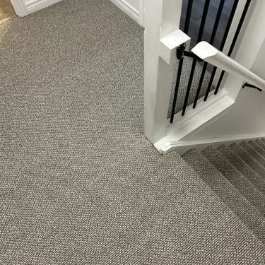 Interstellar Berber Pebble Hill carpet covering stair treads and landing in London Ontario by Master Carpet