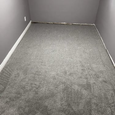 Low-pile Melford carpet installed in a London bedroom – soft, durable carpet providing warmth and comfort.