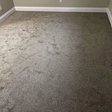 Low-pile plush carpet installed in a London bedroom – soft and cozy carpet for comfortable living.