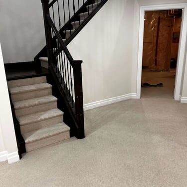 Margo Berber carpet installed in a basement living room – durable, looped carpet perfect for cozy London homes.