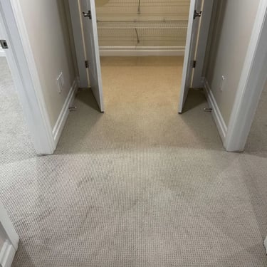 Close-up of Margo Berber carpet installed in a closet in London – durable, textured carpet detail for small spaces.