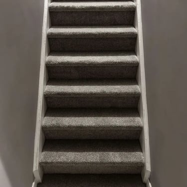 Melford carpet installed on stairs – low-pile, durable carpet flooring providing comfort and style in London, Ontario homes.