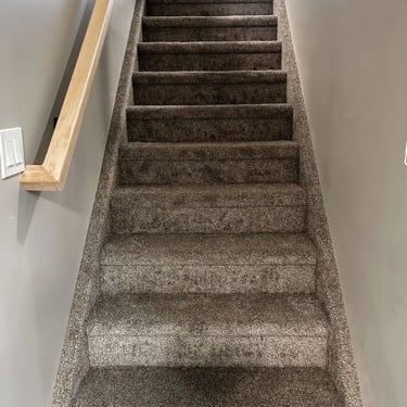 Melford low pile carpet installed on stairs with white stringers – clean and modern finish in London, Ontario.