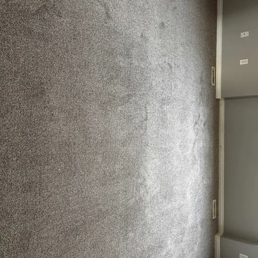 Melford grey low pile carpet installed in Masonville master bedroom – soft, clean look with a modern touch.