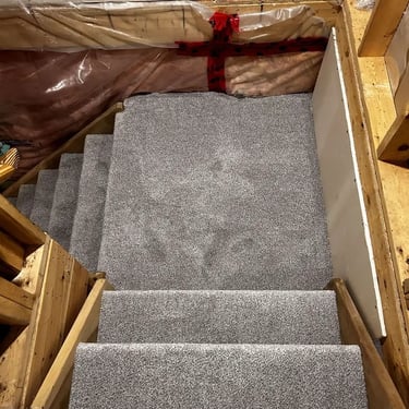 Melford low-pile plush carpet installed on basement stairs with landing – soft, durable