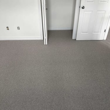 Naples Berber carpet installed in a grey-themed closet – durable and textured flooring providing comfort and style in London