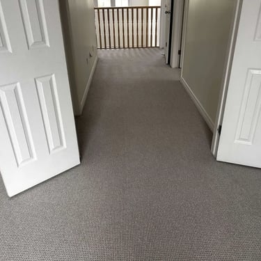 Naples Berber carpet installed in hallway with view into bedroom – textured loop pattern, ideal for busy homes in London!