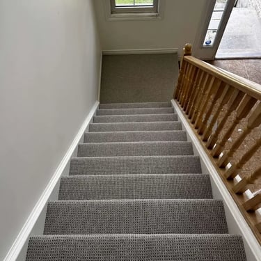 Naples Berber carpet installation on staircase – textured, durable finish in a classic neutral tone, perfect for busy homes