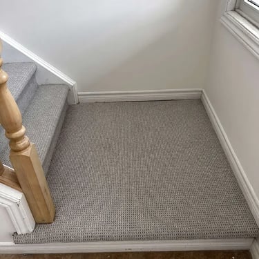 Naples textured Berber carpet installed on stairs with landing in London – beige looped carpet offering a durable and stylish