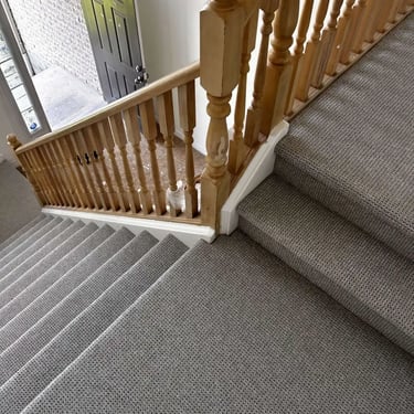 Naples textured Berber carpet installed on stairs and hallway in London – durable looped fibers with a clean, modern look.