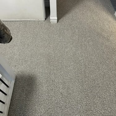 Neutral toned Berber carpet installed in a hallway in London, Ontario showing a clean professional carpet installation