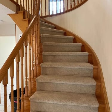 Mcford plush carpet runner installed on staircase, soft grey tone with clean edges and hardwood sides visible