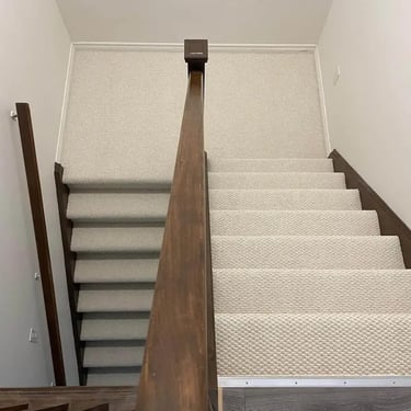 White thick berber carpet installed wall-to-wall on residential stairs in St. Thomas Ontario, soft and durable flooring