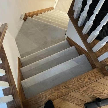 Thick grey carpet installed wall-to-wall on residential stairs in London Ontario, soft and durable flooring