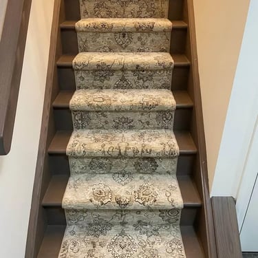 Persian style carpet stair runner installed on residential stairs in London Ontario, elegant and durable flooring