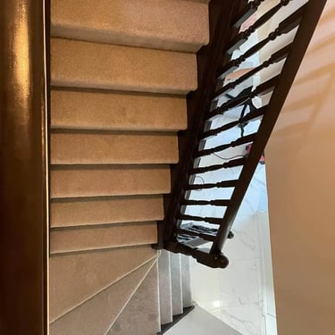 Close-up angle of grey Selkirk carpet installed wall-to-wall on residential staircase in London Ontario home