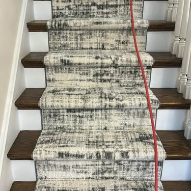 Custom carpet stair runner professionally installed on residential stairs in London Ontario, durable and stylish flooring