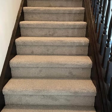 Grey Selkirk carpet installed wall-to-wall on residential staircase in London Ontario, soft and durable flooring