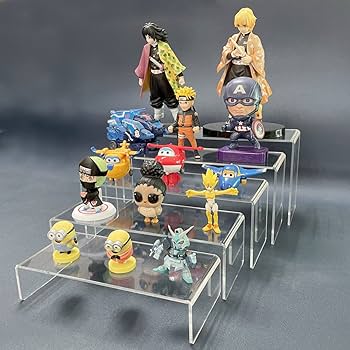 Clear acrylic risers showcasing assorted anime figures in a tiered display arrangement.