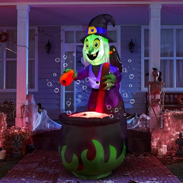 Giant inflatable with with cauldron at night.
