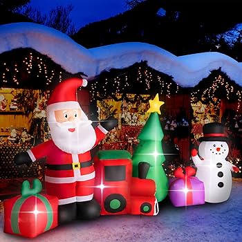 inflatable Santa and snowman decorations at night