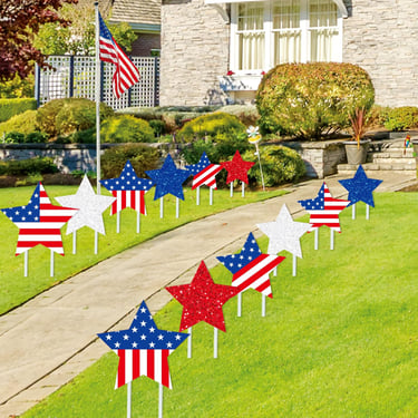 patriotic yard signs along walkway